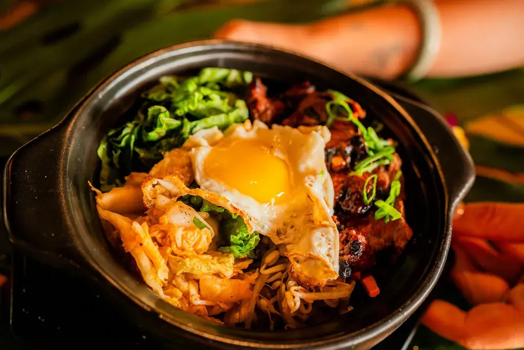 Korean Bowl at Voyagers: a sizzling hot pot of sesame rice, marinated beef, kimchi, vegetables and a fried egg
