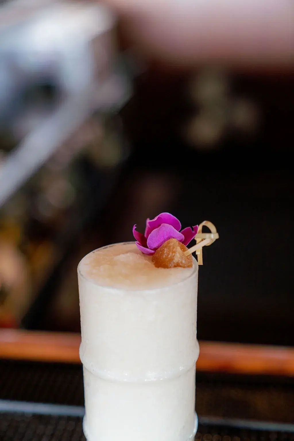 The Makali'i Colada at Voyagers: a coconut milk colada with ginger and lemongrass, garnished with an orchid