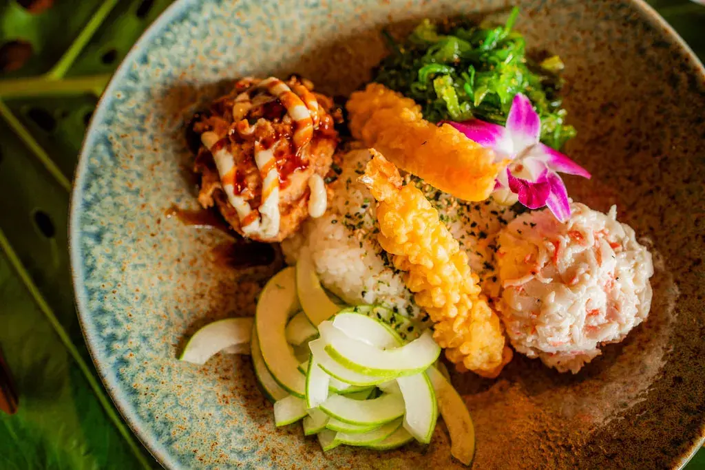 Sushi Bowl at Voyagers: sushi rice, spicy ahi, imitation crab, shrimp tempura, cucumber, seaweed salad and unagi sauce